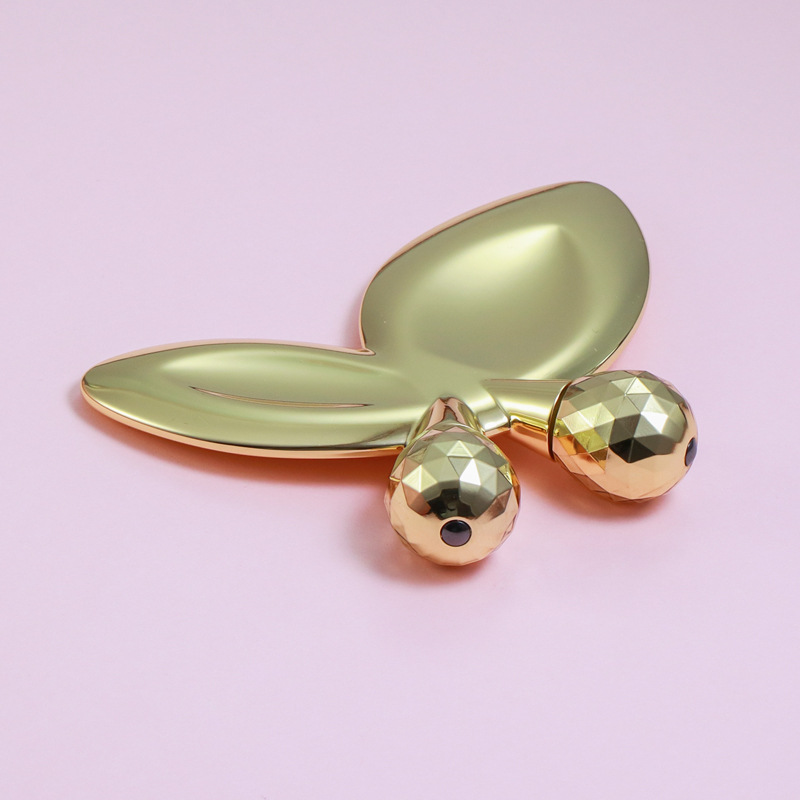 Zinklegering vlindervormige gezichtsmassageroller Zinklegering vlindervormige gezichtsmassageroller