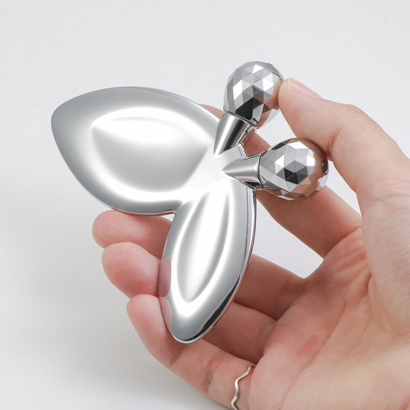 Zinklegering vlindervormige gezichtsmassageroller Zinklegering vlindervormige gezichtsmassageroller