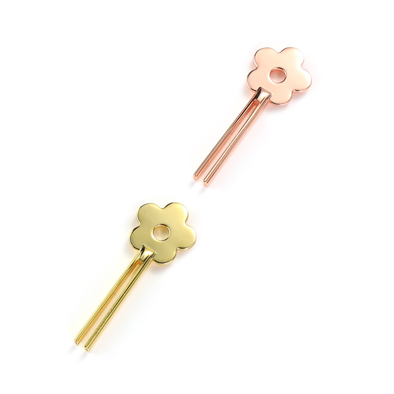 Glimlachende bloemvormige buisknijper van zinklegering Glimlachende bloemvormige buisknijper van zinklegering