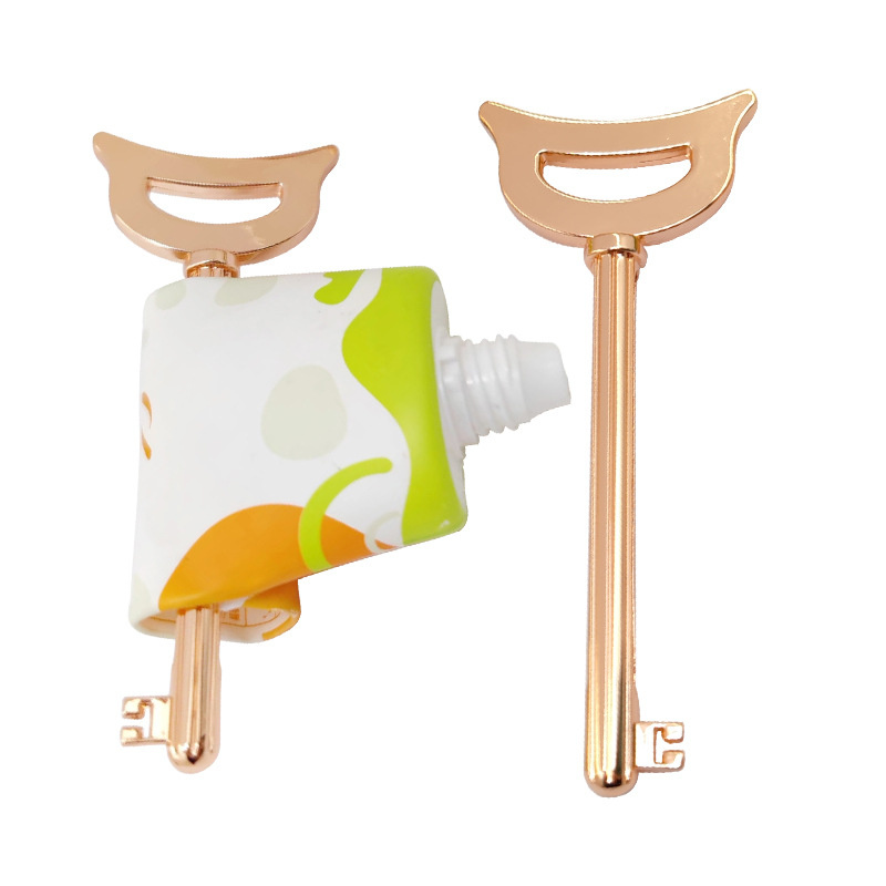 Uniek ontwerp van de sleutelvormige zinklegering tube knijper voor tandpasta cosmetica crème kleurpakket Uniek ontwerp van de sleutelvormige zinklegering tube knijper voor tandpasta cosmetica crème kleurpakket